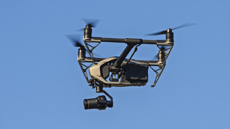 LISBON, PORTUGAL - DECEMBER 03: A drone with a video camera flies over Santo Amaro Recreation dock during Swedish teen climate activist Greta Thunberg arrival on December 03, 2019 in Lisbon, Portugal. The increased use of drones has occasioned a rise in incidents near Lisbon, where one of them crashed on the runway, and other airports. In 2018, the National Civil Aviation Authority (ANAC) reported 53 drone incidents, near almost as many as the 59 reported between 2015 and 2017. (Photo by Horacio Villalobos - Corbis/Corbis via Getty Images)