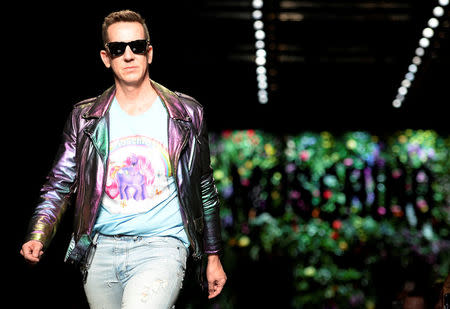 Designer Jeremy Scott acknowledges the applause at the end of the Moschino Spring/Summer 2018 show at the Milan Fashion Week in Milan, Italy, September 21, 2017. REUTERS/Massimo Pinca