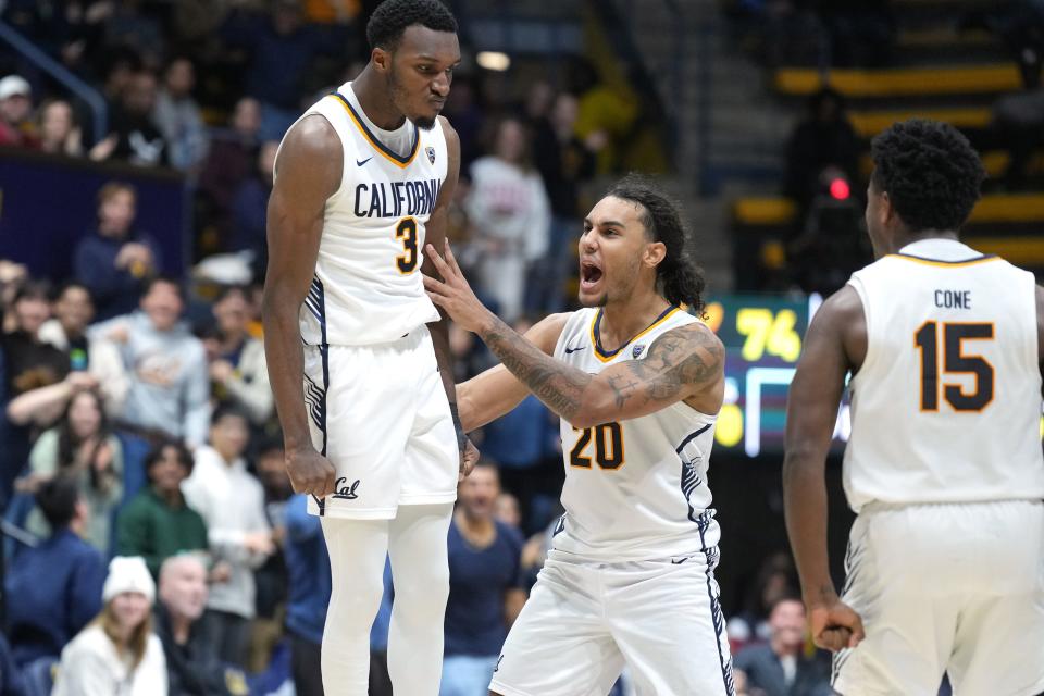 California Golden Bears guard Keonte Kennedy (3) celebrates with guards Jaylon Tyson (20) and Jalen Cone (15) after a dunk against the Washington State Cougars during overtime at Haas Pavilion Jan. 20, 2024, in Berkeley, California.