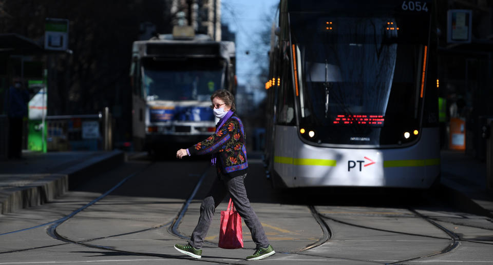 A person wearing a face mask is seen in Melbourne. Source: AAP/James Ross