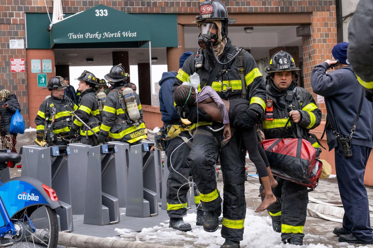 Thirty people, including several children, were critically injured, with firefighters making dramatic rescues using tower ladders and ladders, after a fire broke out inside a third-floor duplex apartment at 333 East 181st St. in the Bronx on Sunday, Jan. 9, 2022.