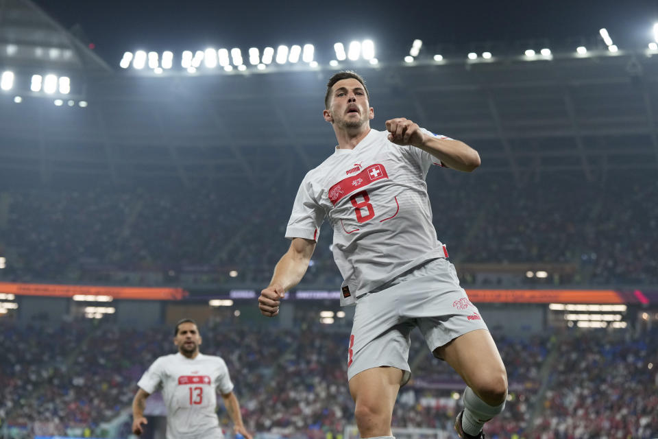 Switzerland's Remo Freuler celebrates after scoring his side's third goal during the World Cup group G soccer match between Serbia and Switzerland, in Doha, Qatar, Friday Dec. 2, 2022. (AP Photo/Ricardo Mazalan)