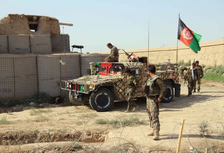 Afghan National Army (ANA) soldiers stand next to an outpost where 12 soldiers were killed by their comrades in the northern city of Kunduz, Afghanistan September 27, 2016. REUTERS/Nasir Wakif