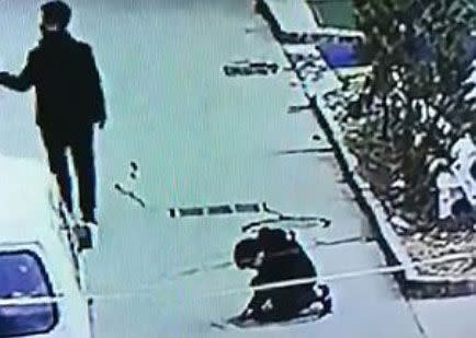 The boy peers down the sewer hole after dropping a firecracker in. Source: AsiaWire