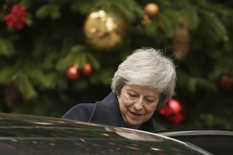 Britain's Prime Minister Theresa May leaves 10 Downing Street to attend the weekly Prime Ministers' Questions session, at parliament in London, Wednesday, Dec. 12, 2018. May has confirmed there will be a vote of confidence in her leadership of the Conservative Party, in Parliament Wednesday evening, with the result expected to be announced soon after.(AP Photo/Tim Ireland)