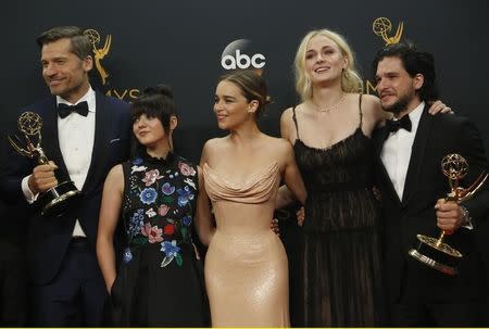 Nikolaj Coster-Waldau (L), Maisie Williams, Emilia Clarke, Sophie Turner and Kit Harrington of HBO's "Game of Thrones" pose backstage with their award for Oustanding Drama Series at the 68th Primetime Emmy Awards in Los Angeles, California U.S., September 18, 2016. REUTERS/Mario Anzuoni