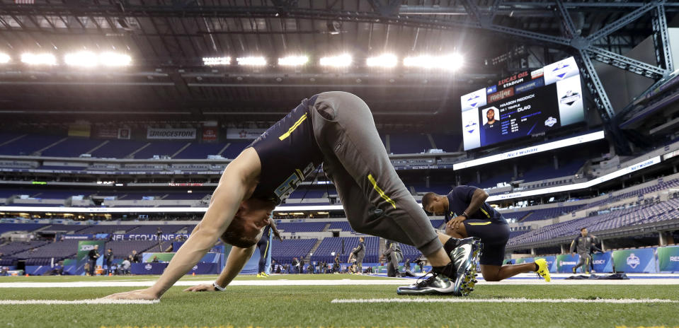 Wisconsin linebacker T.J. Watt stretches at the NFL football scouting combine Sunday, March 5, 2017, in Indianapolis. (AP Photo/David J. Phillip)