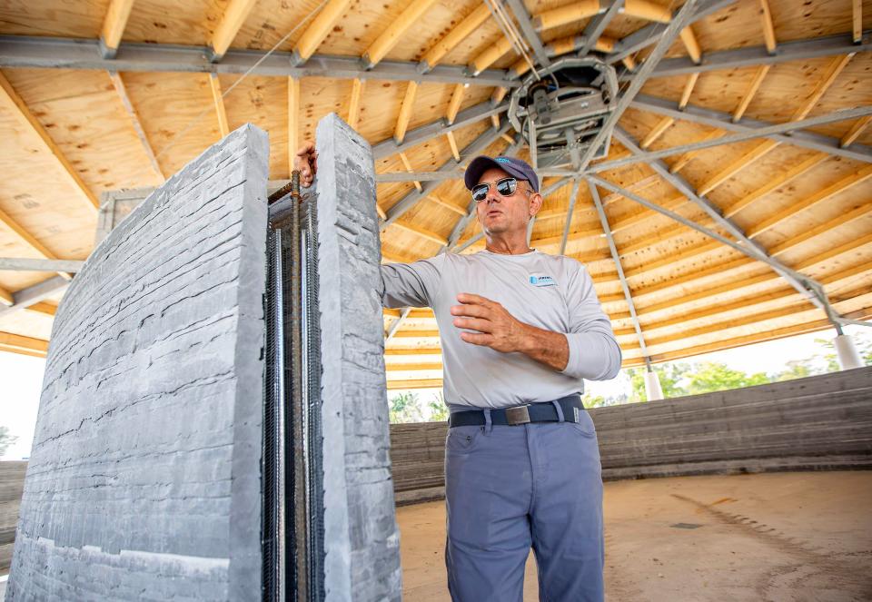 Jim Ritter, 67, founder of Wellington-based Printed Farms LLC, stands next to a circular wall built with a 3D printer for a new 5-acre facility. Nantucket Sports Horses, that will house 16 horses.