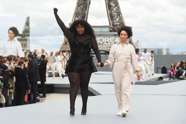 French singer/songwriter Yseult (L) presents a creation for L'Oreal on the sidelines of the Paris Fashion Week Spring-Summer 2022 Ready-to-Wear collection shows at the Trocadero, in Paris on Oct. 3. (Photo: LUCAS BARIOULET via Getty Images)