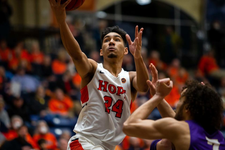 Hope's Evan Thomas drives to the basket during the MIAA Conference Tournament Friday, Feb. 25, 2022, at DeVos Fieldhouse. 