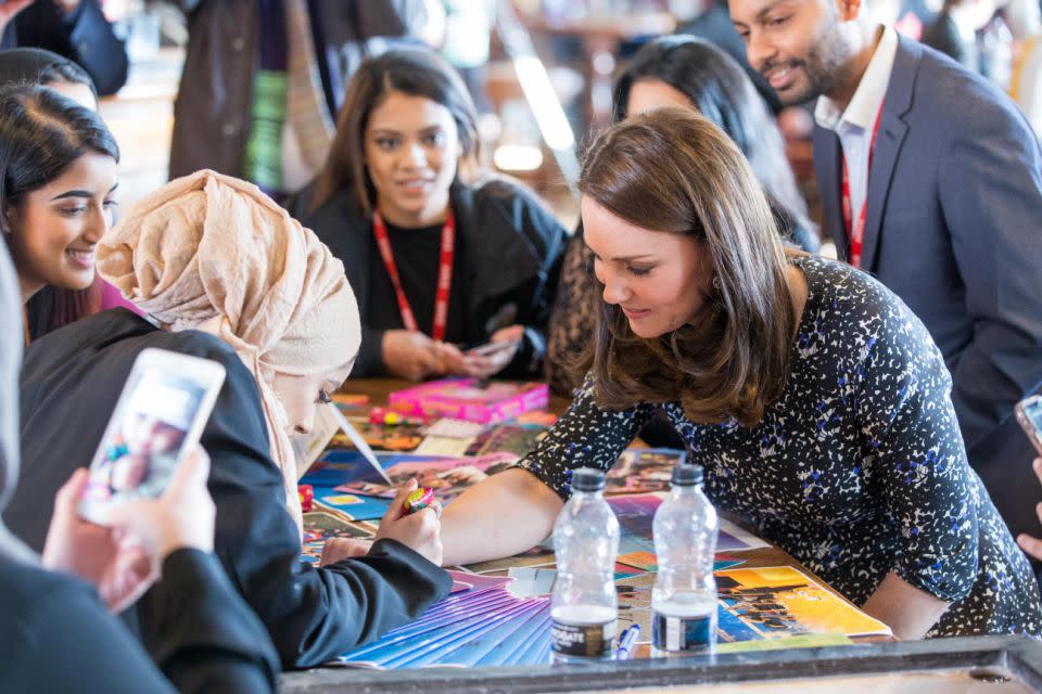 Kate offered up her hand for a tattoo - royal watchers don't fret, it's only temporary. Photo: Getty