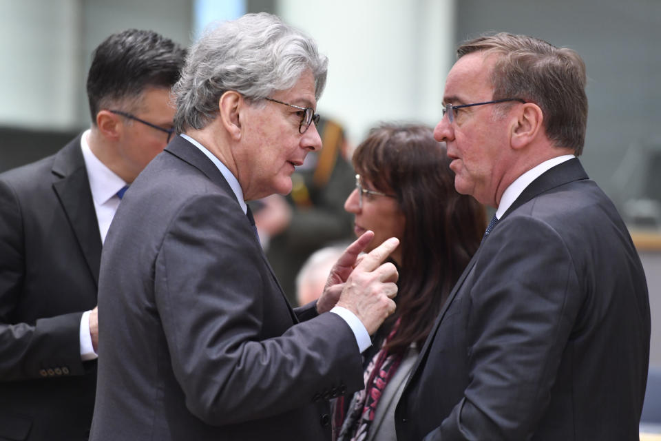 Germany's Defense Minister Boris Pistorius, right, speaks with European Commissioner for Internal Market Thierry Breton during a meeting of EU foreign and defense ministers at the European Council building in Brussels on Monday, March 20, 2023. European Union foreign ministers on Monday will discuss the situation in Ukraine and Tunisia. (AP Photo/Geert Vanden Wijngaert)