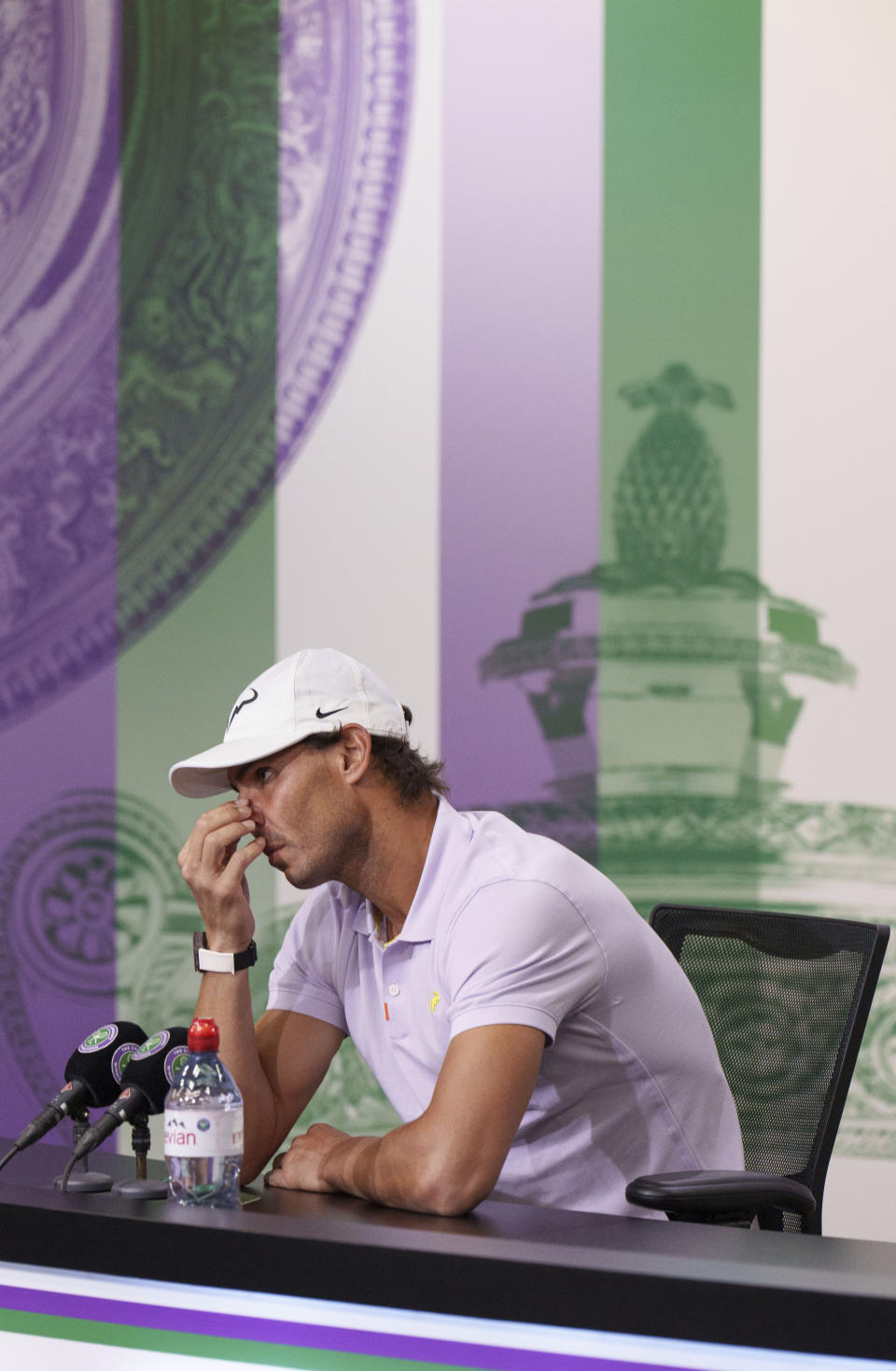 Spain’s Rafael Nadal announces that he is withdrawing from the men’s singles semifinal match at the Wimbledon tennis championships, in London, Thursday, July 7, 2022. Rafael Nadal withdrew from Wimbledon on Thursday because of a torn abdominal muscle, announcing his decision a day before he was supposed to play in the semifinals. (Joe Toth/Pool Photo via AP)