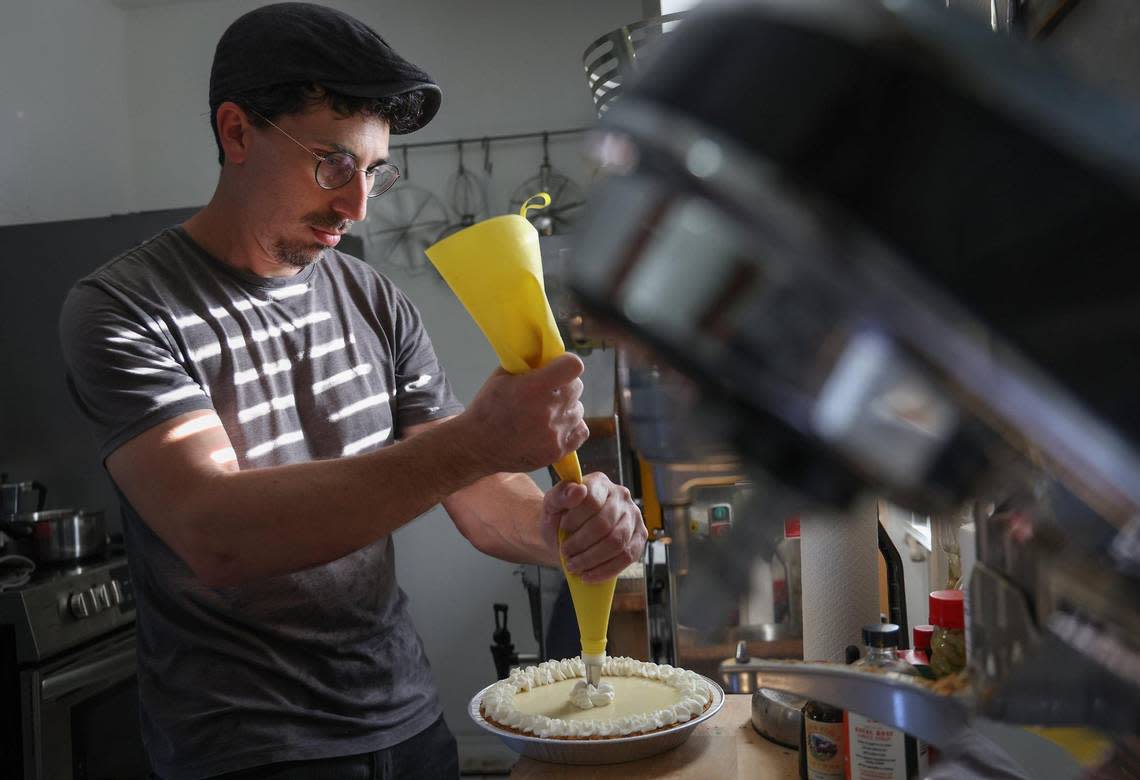 Joshua Abril puts the finishing touches on one of his pies at his Coconut Grove home.