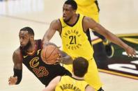 Apr 18, 2018; Cleveland, OH, USA; Cleveland Cavaliers forward LeBron James (23) drives to the basket between Indiana Pacers forward Thaddeus Young (21) and forward Bojan Bogdanovic (44) during the first half in game two of the first round of the 2018 NBA Playoffs at Quicken Loans Arena. Mandatory Credit: Ken Blaze-USA TODAY Sports