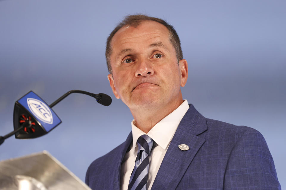 Atlantic Coast Conference commissioner Jim Phillips listens to a question during a press conference at the NCAA college football ACC media days in Charlotte, N.C., Wednesday, July 21, 2021. (AP Photo/Nell Redmond)