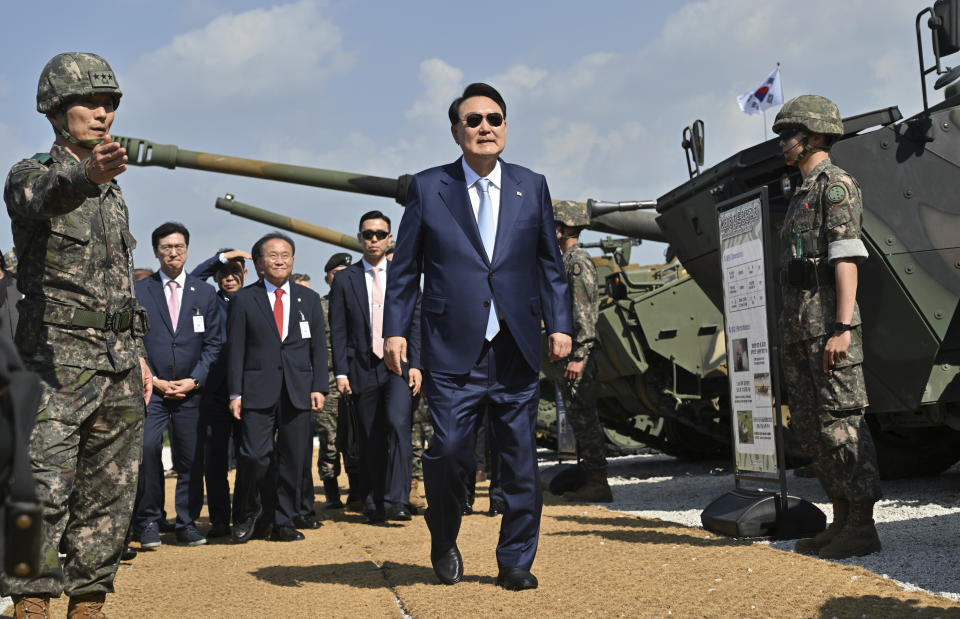 FILE - South Korean President Yoon Suk Yeol, center, looks around military vehicles after a South Korea-U.S. joint military drill at Seungjin Fire Training Field in Pocheon, South Korea, on June 15, 2023. South Korea’s president says he’ll tell world leaders about the need to faithfully enforce U.N. sanctions on North Korea and block the country’s illicit activities to fund its weapons programs when they converge in Indonesia and India for annual summits this week. (Jung Yeon-je/Pool Photo via AP, File)