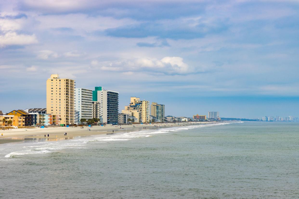 Hotel skycrapers rise over the beaches of Garden City and Myrtle Beach, South Carolina, creating an urban cityscape skyline.