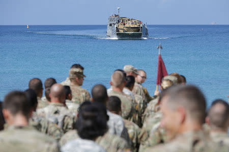 Soldiers from the 602nd Area Support Medical Company wait on a beach for a Navy landing craft as their unit evacuates in advance of Hurricane Maria, in Charlotte Amalie, St. Thomas, U.S. Virgin Islands September 17, 2017. REUTERS/Jonathan Drake