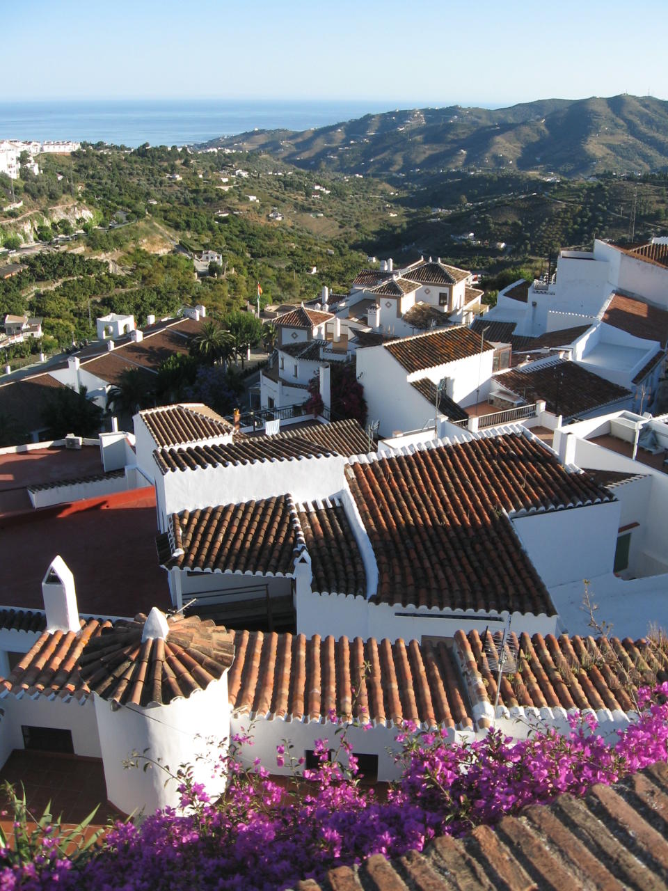 This June 1, 2013 photo shows a cluster of homes in Frigiliana, Spain. Frigiliana is one of Spain's "pueblos blancos," or white villages that sit high above the Mediterranean coast. (AP Photo/Giovanna Dell’Orto)