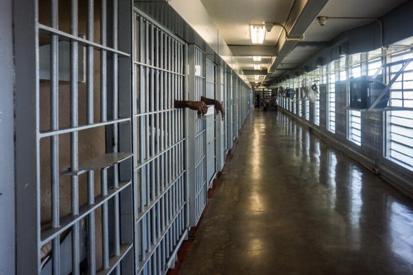 ANGOLA PRISON, LOUISIANA - OCTOBER 14, 2013: A prisoner's hands inside a punishment cell wing at Angola prison. The Louisiana State Penitentiary, also known as Angola, and nicknamed the "Alcatraz of the South" and "The Farm" is a maximum-security prison farm in Louisiana operated by the Louisiana Department of Public Safety & Corrections. It is named Angola after the former plantation that occupied this territory, which was named for the African country that was the origin of many enslaved Africans brought to Louisiana in slavery times. This is the largest maximum-security prison in the United States[with 6,300 prisoners and 1,800 staff, including corrections officers, janitors, maintenance, and wardens. It is located on an 18,000-acre (7,300 ha) property that was previously known as the Angola Plantations and bordered on three sides by the Mississippi River. (Photo by Giles Clarke/Getty Images)