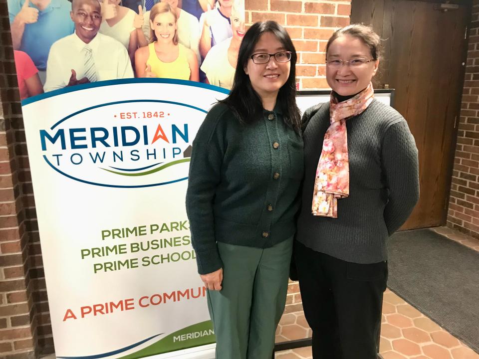 Greater Lansing Chinese Association Vice President Jane Li and Treasurer Yin Zhang pose for a portrait at Meridian Township Hall on Jan. 5, 2023.