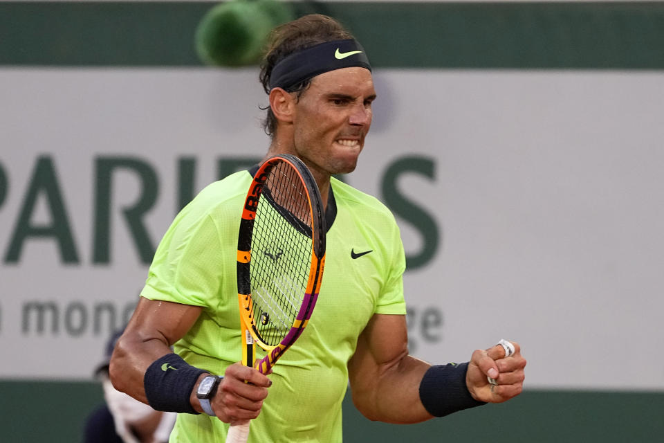 Spain's Rafael Nadal clenches his fist as he plays Serbia's Novak Djokovic rduring their semifinal match of the French Open tennis tournament at the Roland Garros stadium Friday, June 11, 2021 in Paris. (AP Photo/Michel Euler)