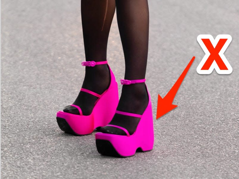 An "x" pointing at neon-pink heels.