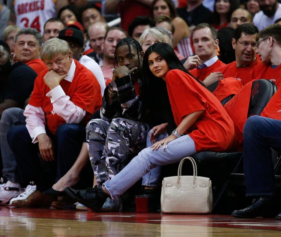 Houston rapper Travis Scott and Kylie Jenner watch courtside during an NBA playoff game at Toyota Center on April 25, 2017 in Houston.