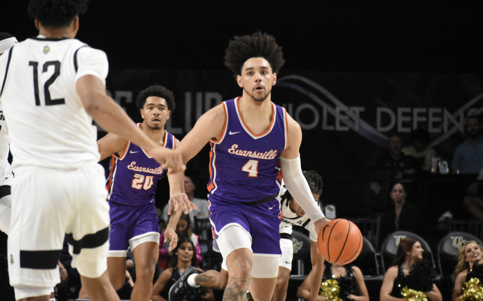 Evansville men's basketball guard Marvin Coleman II brings the ball up the floor against UCF.