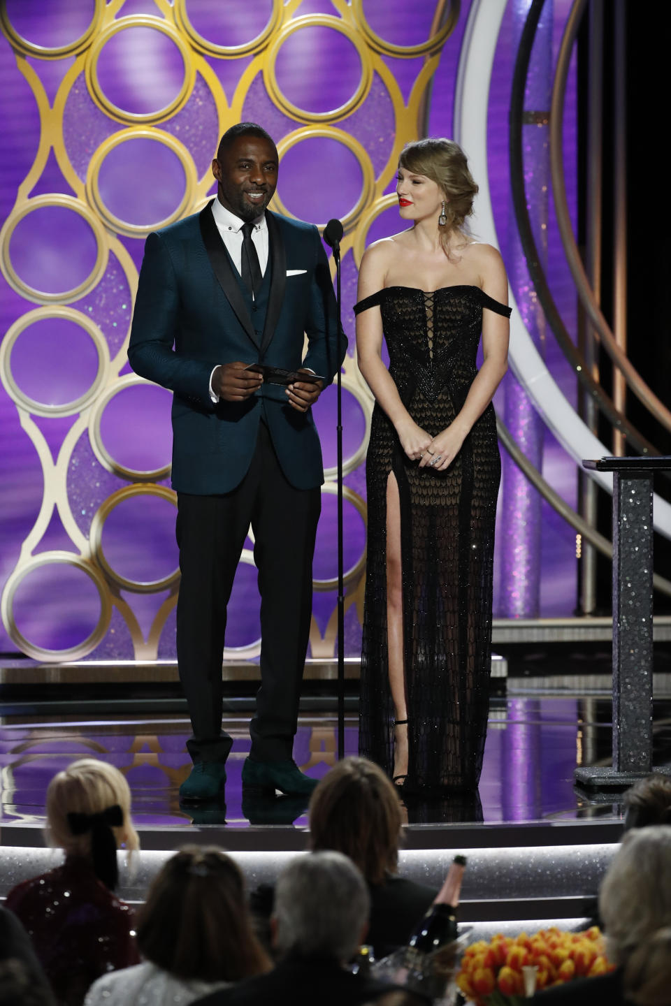 Presenters Taylor Swift and Idris Elba speak onstage during the 76th Annual Golden Globe Awards at The Beverly Hilton Hotel on January 06, 2019 in Beverly Hills, California. | Handout/NBCUniversal—Getty Images