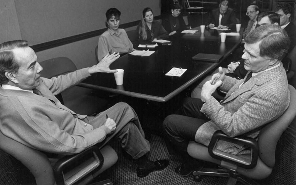 Sen. Bob Dole, R-Kan., talks with the Lawrence Coalition for Peace on Jan. 26, 1991. Throughout his career as a prominent Republican politician, Dole sought to champion better services for people with disabilities after having lost full use of his right arm and hand after being injured in World War II.