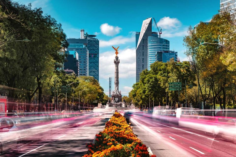 Cars in motion along the Paseo de la Reforma in Mexico City, Mexico, voted one of the best cities in the world