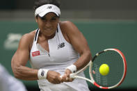 Britain's Heather Watson returns the ball to Slovenia's Kaja Juvan in a third round women's singles match on day five of the Wimbledon tennis championships in London, Friday, July 1, 2022. (AP Photo/Alastair Grant)