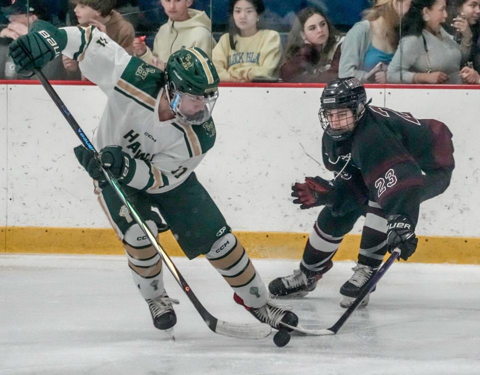 Bishop Hendrickon's James Cararra, left, battles with Prout's Drew Nowell during Friday night's game.