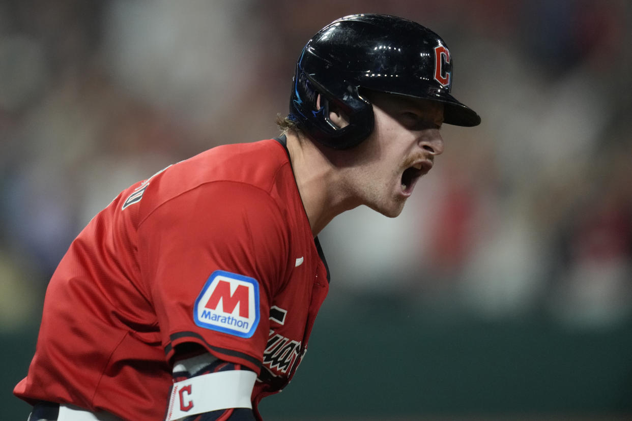 Cleveland Guardians' Kyle Manzardo reacts as he runs the bases after hitting a home run in the eighth inning of a baseball game against the Minnesota Twins, Monday, Sept. 16, 2024, in Cleveland. (AP Photo/Sue Ogrocki)