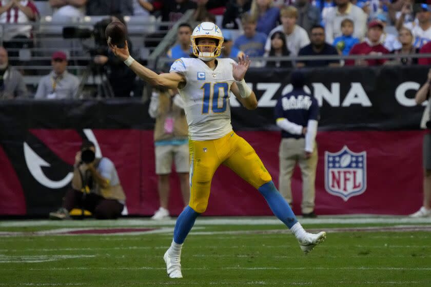 Los Angeles Chargers quarterback Justin Herbert (10) throws against the Arizona Cardinals during the second half of an NFL football game, Sunday, Nov. 27, 2022, in Glendale, Ariz. The Chargers defeated the Cardinals 25-24. (AP Photo/Rick Scuteri)