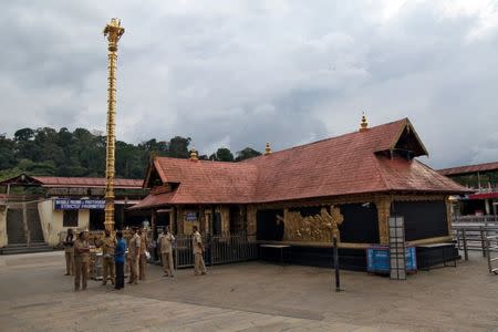 Police stand inside the premises of the Sabarimala temple in Pathanamthitta district in Kerala, India, October 17, 2018. REUTERS/Sivaram V/Files