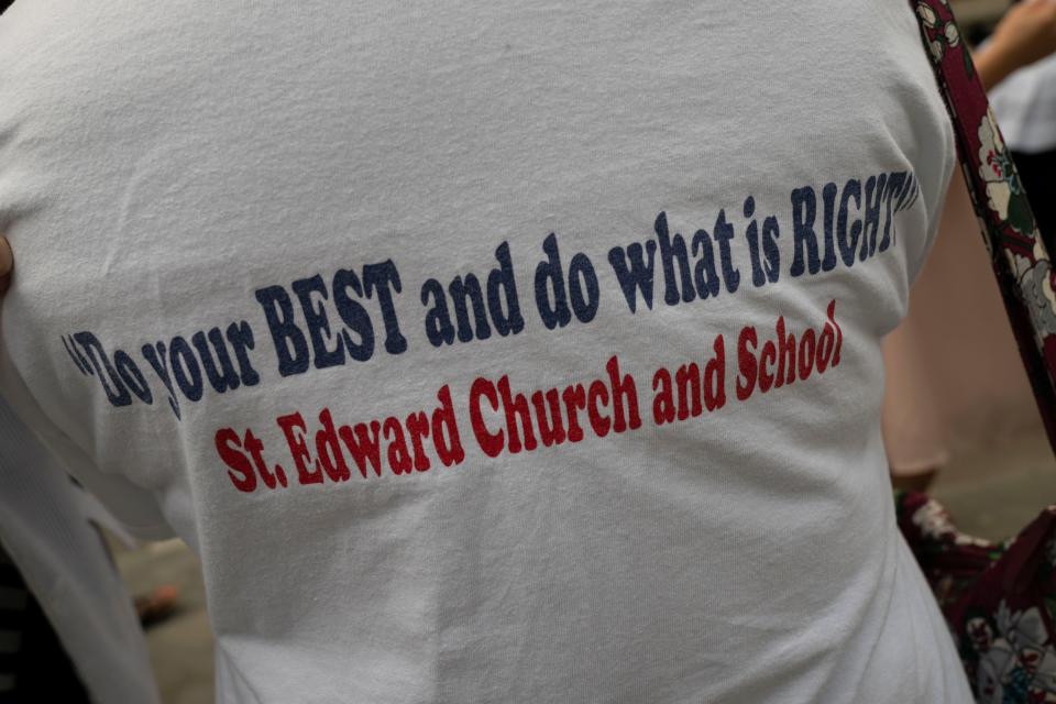 Barbara Smith wears a T-shirt with the Rev. Joseph Patrick Breen quote "Do you BEST and do what is RIGHT" following a funeral Mass for Breen at Christ the King Catholic Church Friday, May 27, 2022, in Nashville, Tenn.