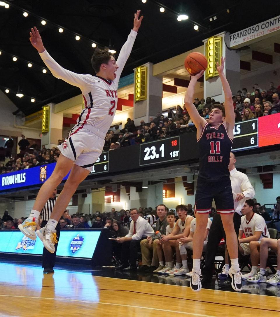 Rye's Carson Miller (2) works to block the shot from Byram Hills' Ari Breilinger (11) in the Section 1 Class A boys basketball championship game at the Westchester County Center in White Plains on Saturday, March 2, 2024.