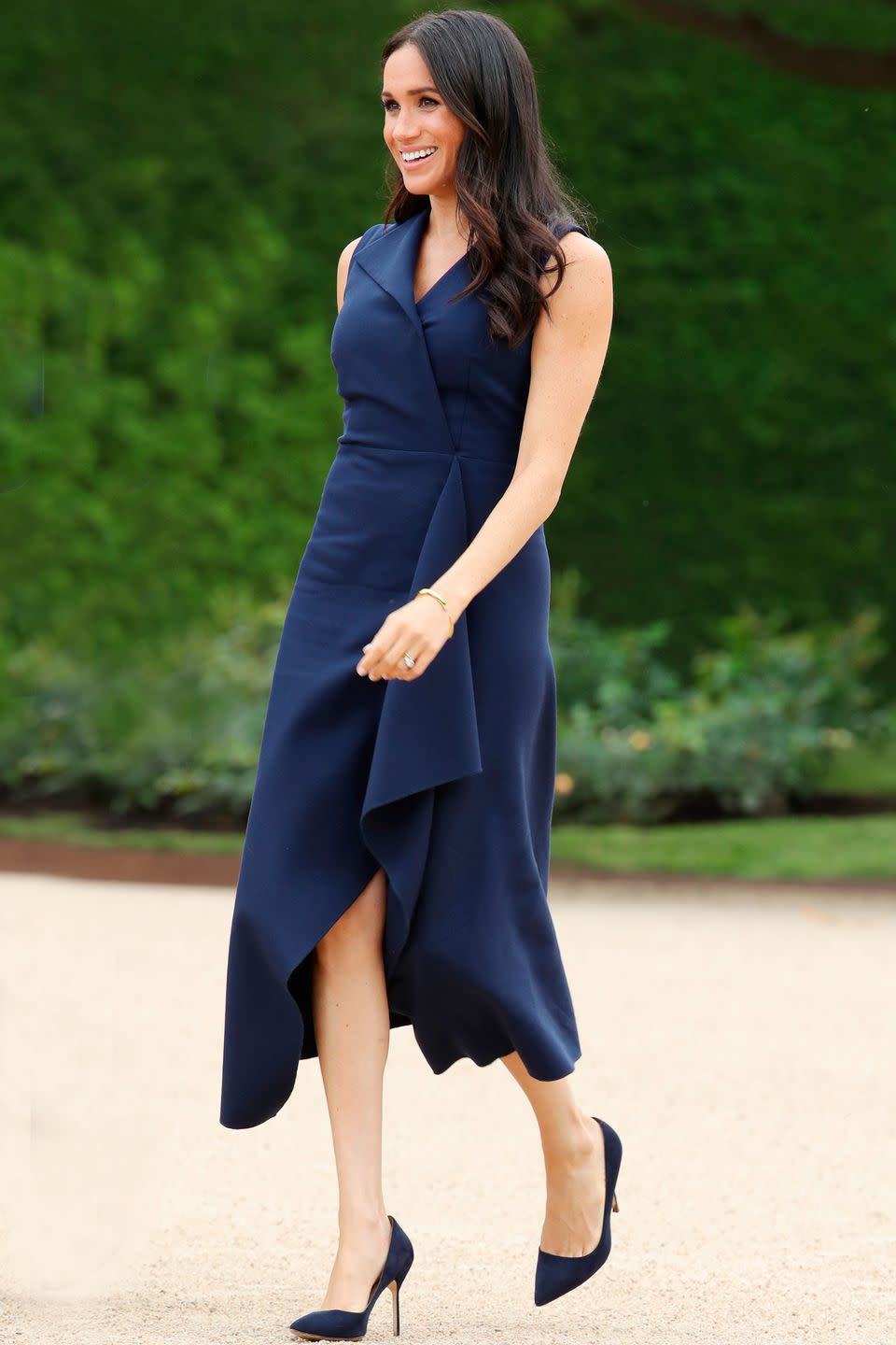 <p><strong>October 2018</strong> The duchess teamed her navy Roland Mouret frock with a pair of Manolo Blahnik 'BB' heels.</p>
