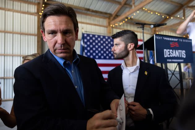 Florida Gov. Ron DeSantis speaks with supporters and signs autographs during a presidential campaign stop in Gilbert, South Carolina, on June 2, as part of a four-day tour covering New Hampshire and other states.