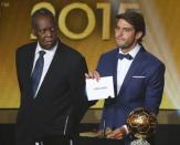 Brazil's Kaka unveils the name of FC Barcelona's Lionel Messi of Argentina as winner of the FIFA Ballon d'Or 2015 for the world player of the year, during an awards ceremony in Zurich, Switzerland, January 11, 2016. At left is FIFA acting President Issa Hayatou. REUTERS/Ruben Sprich