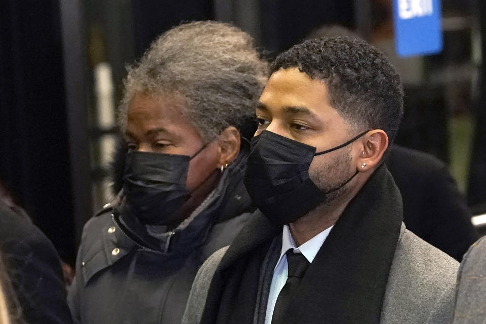 Actor Jussie Smollett, along with his mother Janet, returns to the Leighton Criminal Courthouse, Thursday, Dec. 9, 2021, in Chicago, after a jury reached a verdict in his trial. Smollett was convicted Thursday on five of six charges he staged an anti-gay, racist attack on himself nearly three years ago and then lied to Chicago police about it. (AP Photo/Charles Rex Arbogast)