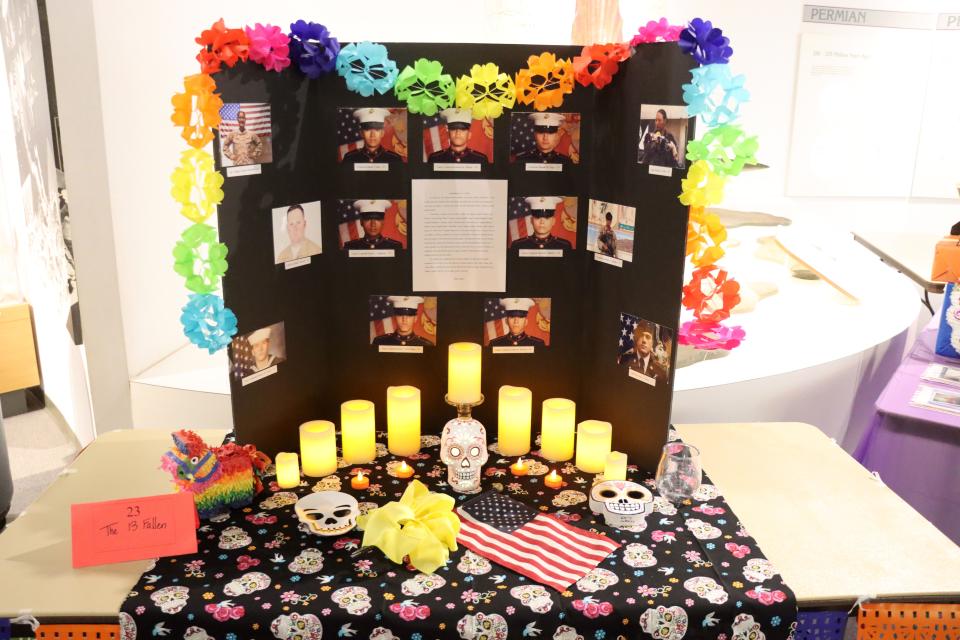 This 2021 file photo shows the table for the West Texas A&M Dia de los Muertos display at Panhandle Plains Historical Museum honoring the death of the 13 soldiers lost in an airport suicide bombing attack in Afghanistan.