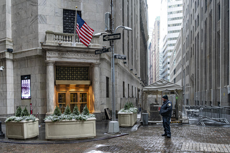 A security officer stands outside an entrance to the New York Stock Exchange on Friday, Jan. 19, 2024, in New York. Wall Street is rising Friday and may break past its all-time high set two years ago, before the highest inflation and interest rates in decades sent financial markets tanking worldwide. (AP Photo/Peter K. Afriyie)