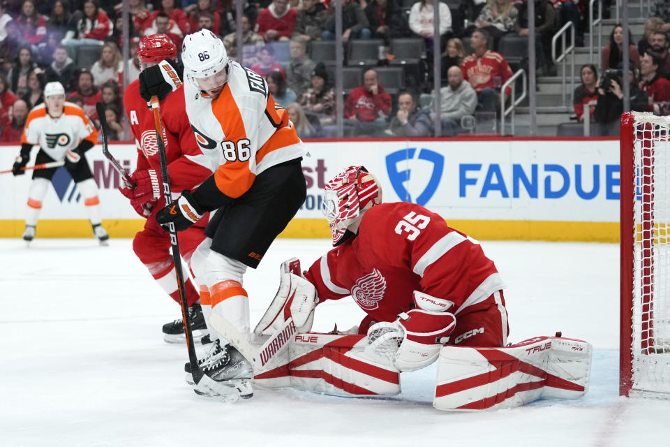 Detroit Red Wings goaltender Ville Husso (35) stops a Philadelphia Flyers left wing Joel Farabee (86) deflection in the second period of an NHL hockey game Saturday, Jan. 21, 2023, in Detroit. (AP Photo/Paul Sancya)