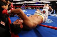 NEW YORK, NY - OCTOBER 20: Erik Morales is knocked out by Danny Garcia in the fourth round during their WBC/WBA junior welterweight title at the Barclays Center on October 20, 2012 in the Brooklyn Borough of New York City. (Photo by Al Bello/Getty Images for Golden Boy Promotions)