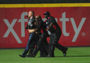 Members of the Atlanta Braves security staff remove a fan who ran onto the field during a gregame rain delay against the Washington Nationals at Turner Field on August 9, 2014 in Atlanta, Georgia. (Photo by Scott Cunningham/Getty Images)