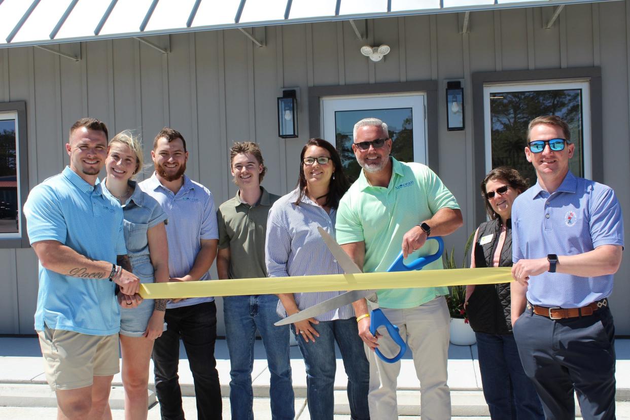 Pictured from left, Hunter Penley, director of operations: Lacey Penley, office manager; Kitt Capell, estimator; Peyton Skiles, project manager; April Annas and Kevin Annas, owners; Felica Sexton and Justin Cutrell, Southport Oak-Island Chamber board members.